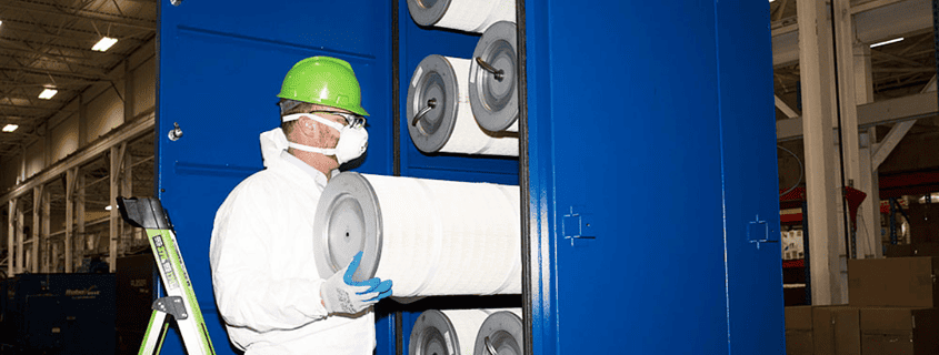 Maintenance personnel changing cartridge collector