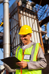 Baghouse technician inspecting a new dust collector