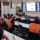 A maintenance team is receiving a class from a professional preventive maintenance specialist to evaluate equipment condition, identify developing problems, and support reliable baghouse operation.